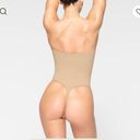 SKIMS STRAPLESS THONG BODYSUIT Photo 1