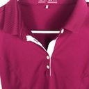 Nike  golf woman’s Magenta dri-fit 5 button polo shirt EUC Stretch size Medium Photo 1