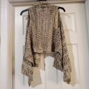 It’s Our Time It's our time sweater Vest cardigan is a size small. Photo 1