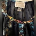 cupio Sheer long sleeve blouse is a size Large. Photo 2