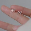 Trendy Silver Bow Earrings Studs Photo 3