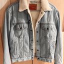 Levi’s Sherpa-Lined Denim Trucker Jacket Photo 0