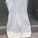 by the way. Adorable white bodycon dress with lace up details on the front and sides Photo 1