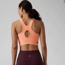 Athleta  Bright Peach Conscious Crop Cut Out Bra A-C Photo 1