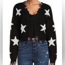 Polly & Esther Black distressed star sweater Photo 0