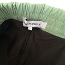 We Wore What  layered green black spandex running shorts Photo 5