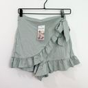 Halara  High Waisted Lace Up Ruffle Hem Flowy Casual Shorts 3.5" Green Lily Photo 1