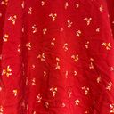 Modcloth  knee-length skirt. Red with dainty yellow floral print. Elastic waist. Photo 2