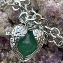 Green gemstone in a winged heart shaped necklace cage. 36”chain. Heart opens Photo 3