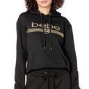 Bebe NWT  Black and Gold Glitter Logo Long Sleeve Pullover Hoodie Size Small Photo 0