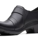 Clarks Clark’s collection ULTIMATE comfort ANGIE PEARL BLACK LEATHER Upper CUIR NOIR BALANCE MAN MADE MATERIAUX SYNTHETIQUES slip on New with tag  Same day shipping  Smoke and pets free  Elevate your casual wardrobe with these  slip-on shoes from the Angie collection. The black leather upper is complemented by a low heel, making them perfect for everyday wear. The shoes feature a slip-on closure, making them easy to wear and remove, and are designed for ultimate comfort.   The Angie Pearl shoes are a solid pattern, with a shoe width of M. They are perfect for women looking for comfort shoes, with features such as a comfortable sole and leather upper material. These shoes have a UK shoe size of 5.5 and a US shoe size of 6.5/7/9, making them suitable for a wide range of foot sizes. Photo 1