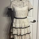 Shoshanna Stacia Lace Tiered Polka Dot Knee Length High Neck Black trim on neck/sleeve/bottom Hidden back zipper A flutter sleeve ballet lace fit-and-flare mini dress with ruffle detail below the waist ivory cream Kentucky Derby mock sheer layer Photo 2