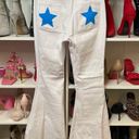 Vibrant White bell bottom jeans with stars on pockets Photo 0