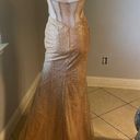 Cinderella Divine Women’s formal sparkly dress size 4
Brand is 
Rose gold color Photo 15