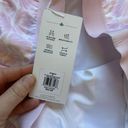 Lady Hagen NWT  16 inch Side pleated Pink and White Seashell golf skort.‎ Size M Photo 4