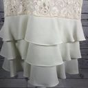 Leslie Fay  sleeveless 
Beautiful lace dress with layered ruffles on the end. Photo 11