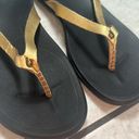 Olukai  Ho'Opio Womens Gold Black Slip On Thong Sandals Photo 4