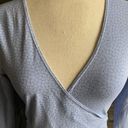 Brandy Melville Beautiful blue with tiny white flowers wrap top, long sleeves, has stretch, excellent condition, size medium Measurements: Bust: armpit to armpit 16 inches  Length: shoulder seam to bottom 17 inches Photo 3