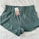 Halara  High Waisted Dolphin Hem Shorts Green Size L NWT Photo 4