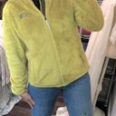 The North Face  green fuzzy jacket size medium with pockets Photo 0