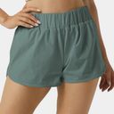 Halara  High Waisted Dolphin Hem Shorts Green Size L NWT Photo 0