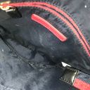 Tommy Hilfiger  Crossbody purse bag in black w/ red accents.  Excellent Condition Photo 6