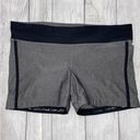 Xersion fitted athletic shorts with no slip hem, black and grey women size Large Photo 0