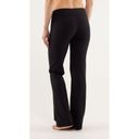 Lululemon  Astro Black Criss Cross Waistband Flared Leg Yoga Pant 6 Photo 2