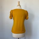 Cyrus Solid Mustard Short Puff Sleeve V-Neck Blouse Photo 1