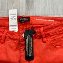 Bebe NWT  destroyed heartbreaker skinny jeans in orange Photo 1