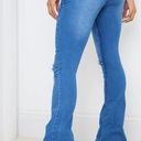Pretty Little Thing Mid Blue Distressed Knee Flare Jean Photo 2
