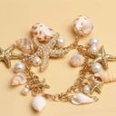 Jewelry by Lyra Beachy gold and white charm bracelet with starfish and seashells. NWT Photo 2