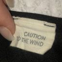 Caution to the Wind Fitted black dress with ruffle cut out detail Photo 3