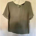 Staccato  green blouse with tie back closure. Size large Photo 0