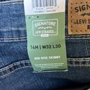 Levi's LEVI STRAUSS Mid rise skinny jeans | 14/32w 30L Photo 4