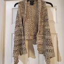 It’s Our Time It's our time sweater Vest cardigan is a size small. Photo 0