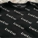 Bebe  black logo all over print crewneck sweater, size L designer boho spring Photo 8