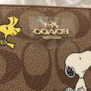 Coach  X Peanuts Long Zip Around Wallet In Signature Canvas Snoopy Woodstock Photo 1