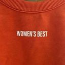 women's best Women’s Best size large orange cropped sweatshirt. Photo 1