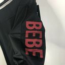 Bebe NEW  Sport Net Mesh Pocket Biker Shorts in Black/Hibiscus Women's Plus Sz 2X Photo 1