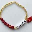 Taylor Swift  Friendship Bracelet Eras Tour Cherry Lips Blank Space 1989 w/ Charm Photo 1