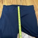 Vuori  Stride Legging in Navy Blue Side Pocket Back Zippered Pocket Photo 4