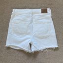 American Eagle  high rise shortie white jean shorts in size 0 Photo 1