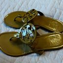 Tory Burch  gold flip flops size 7 Photo 1