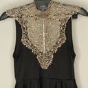 Arden B Unique black and gold blouse with beautiful details open back with bow. Medium Photo 2