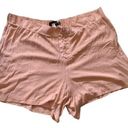 Torrid  | pink crepe lace front shorts Photo 0