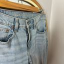 American Eagle Outfitters distressed 90s skinny jeans with raw hem Photo 1