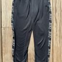 Nike women’s small  dri-fit black joggers with pockets Photo 0