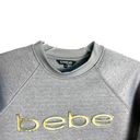 Bebe Sport Gray w 3D Gold Lettering Athletic Top Thumb Slits Wm M Photo 1