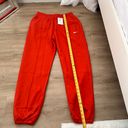 Nike swoosh red/orange sweatpants Photo 1